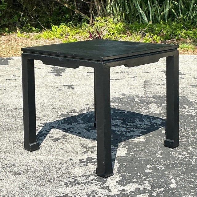 Elevate your game nights and conversation corners with this bold and sophisticated vintage square game table. Wrapped in a...