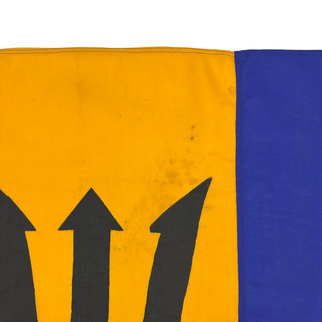 This vintage Barbados flag is made from a blended wool cloth, with sewn panels and printed emblem visible on both sides....