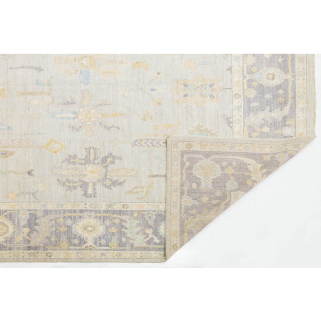 Elevate your space with the elegance of this Modern Oushak Style Wool Rug, blending Turkish design with a contemporary...
