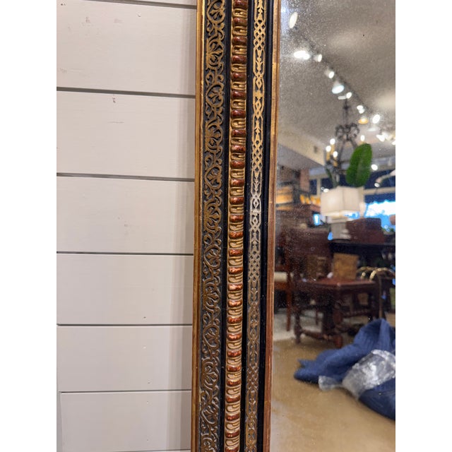 This is a beautiful 19th Century Louis Philippe mirror with a rare ebony trim finish, circa 1830. The frame features gold...