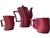 A striking vintage Royal Orchid Stoneware coffee service in a rich burgundy/wine glaze, featuring a sculptural ribbed form...