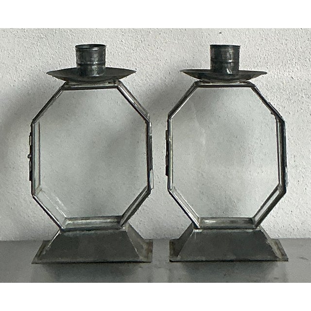 Introduce a touch of captivating vintage allure with this striking pair of octagon glass case candlesticks, embodying a...