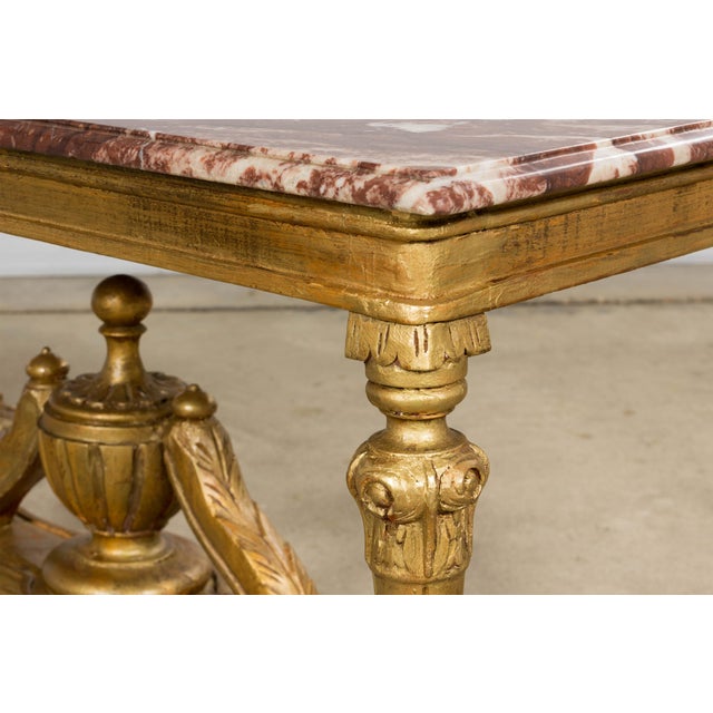 A refined mid 19th century French Napoleon III coffee table, sourced in Provence, featuring a richly figured rouge marble...