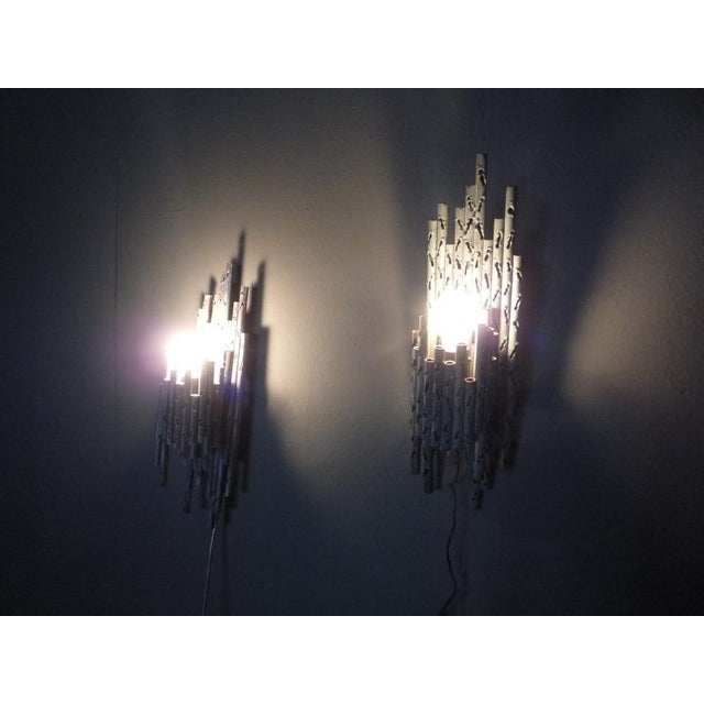 Two brutalist copper sconces. Each lamp is unique and handmade. Very good original condition and working. 1 lamp has a...