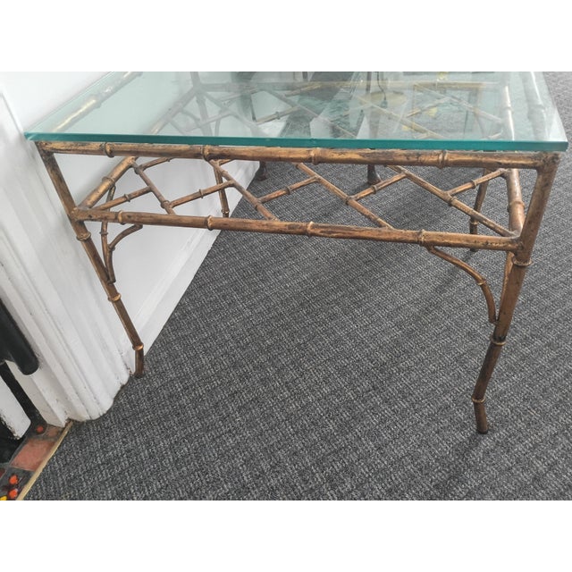 A pair of Hollywood Regency faux bamboo gilt iron side tables 28" featuring Chinese Chippendale Cockspen style storage...