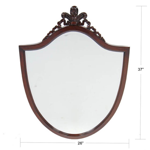 A solid Mahogany Carved Mirror from Niagara Furniture with hand carving helps discern this piece from it’s mass produced...