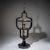 Elegant ebonized étagère raised on an octagonal base with a tapered central column. Above rises a four-tiered structure...