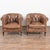 Pair of 20th century Danish club chairs upholstered in vintage brown leather. Each chair features a tufted button back,...