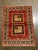 Vintage Hand-knotted Persian Kashkoli wool rug featuring a rich red field with two central square medallions, each divided...