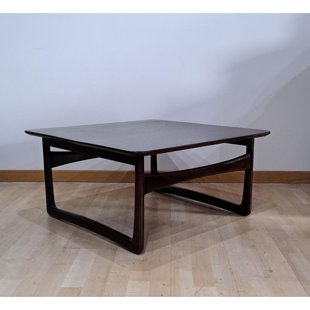 1950s teak coffee table with legs and sled by Peter Hvdit & Orla Molgaard-Nilsen This piece is attributed to the mentioned...