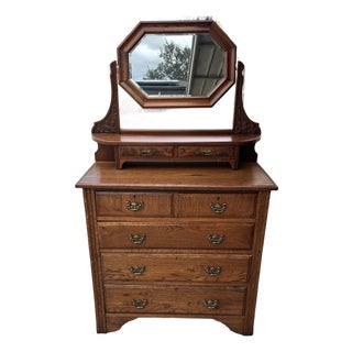 Antique Quartersawn Oak Chest of Drawers Featuring an Adjustable Octagonal Swing Mirror and Decorative Brass Pulls For Sale