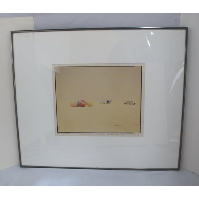 Richard Misrach (American, 1949) , photograph titled "Desert Croquet #3 (Balls, Plane, Car)", Black Rock City, Nevada,...