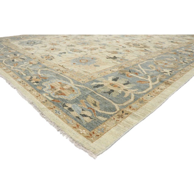 60920 Persian Sultanabad Rug, 11'10 x 15'06. This hand-knotted wool Persian Sultanabad rug features an all-over botanical...