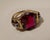 A vintage ring from the 19th century, dating from 1890, crafted in 18-karat yellow gold, featuring four small gemstones...