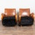 Pair of mid-century modern Danish club chairs. The chairs feature dramatic curved arms and fronts, with bentwood framing...