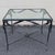 Elegant and sculptural, this vintage wrought iron and glass center table embodies the timeless sophistication of French...
