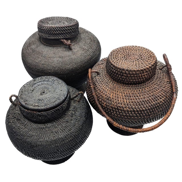Offered are three hand-woven baskets with lids acquired in the early 1970s on an excursion to visit the rice paddies in...