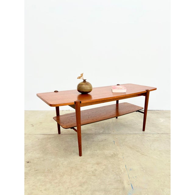 Coffee table designed by Louis Van Teeffelen for the manufacturer Webe, Netherlands, 1960s. Solid teak frame, four tapered...