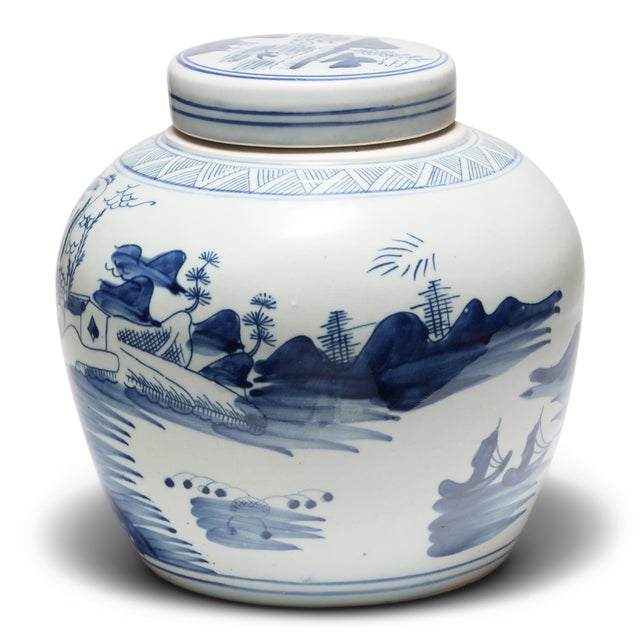 This round, porcelain ginger jar is brightly glazed in the blue-and-white manner. A combination of stenciled linework and...