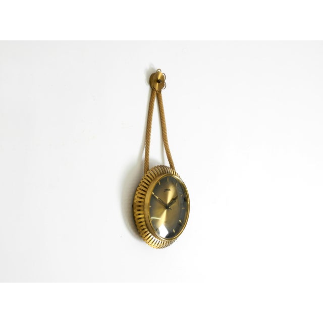 Small mechanical wall clock by Atlanta, original Mid-Century Modern. Made in Germany. Beautiful design in a compact size....