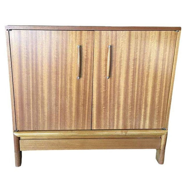 Rare Brown Saltman "6057 Server " mahogany cabinet/buffet designed by John Keal. The cabinet contains a fixed shelf with a...