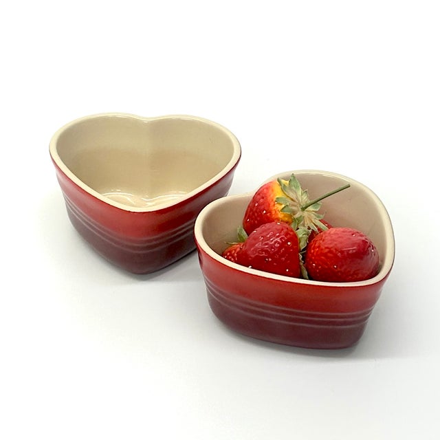 Heart ramekins, set of 2. A charming set of cerise red heart-shaped stoneware ramekins by Le Creuset—perfect for baking...