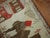 Vintage Turkish pictorial rug woven in central turkey depicting two large camels and a small horse. 3'6'' x 6'4''