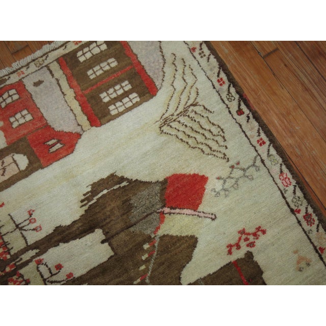 Vintage Turkish pictorial rug woven in central turkey depicting two large camels and a small horse. 3'6'' x 6'4''