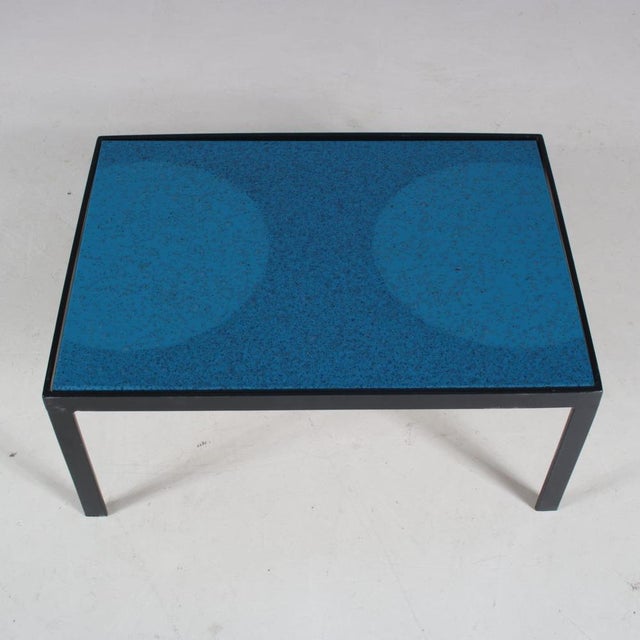 A nice, small coffee table manufactured in the Netherlands in the 1960s. This lovely table has a black metal frame and...