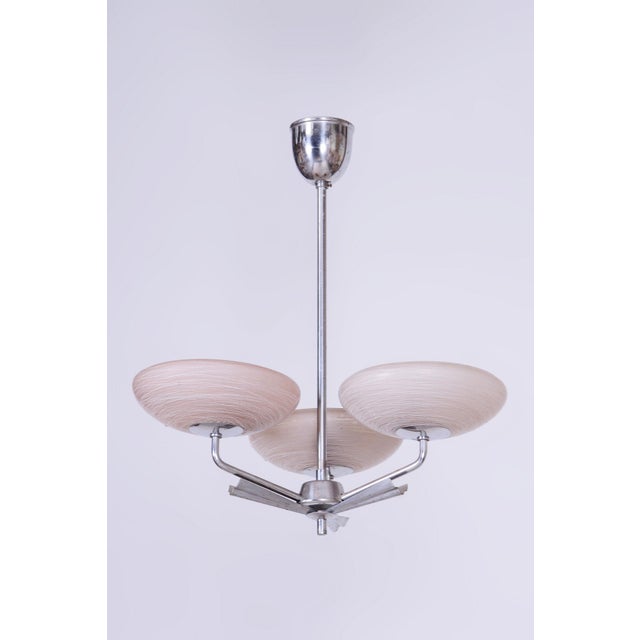 This three-arm chandelier is a prime example of 1920s Czechoslovak Art Deco design. The fixture stands out for its...