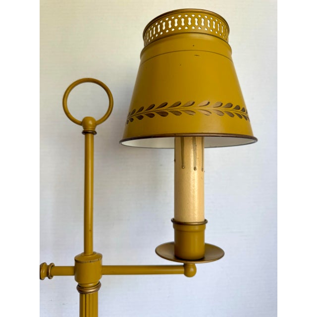 Here is a vintage mid-20th century bouillotte-style table lamp featuring a fantastic mustard-yellow finish and decorative...
