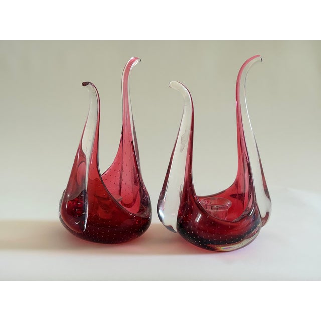 Ruby red glass with controlled bullicante technique—precisely distributed air bubbles creating internal luminosity. The...