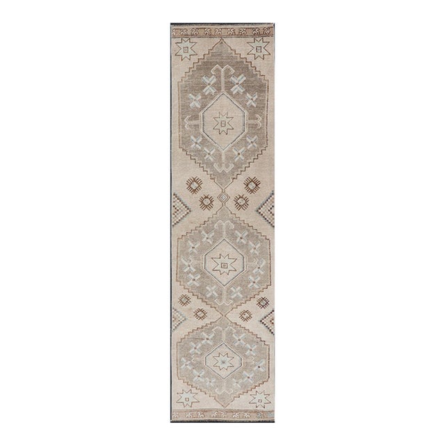 Vintage Turkish Oushak Runner With Soft Earth Tones and Geometric Star Motifs For Sale