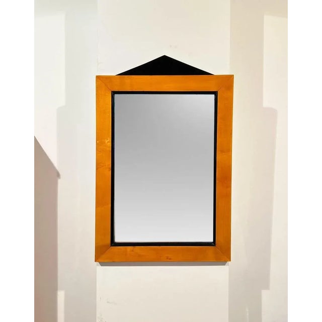 Rectangular Biedermeier wall mirror from South Germany circa 1820. Solid maple wood with an ebonized classicist cornice....