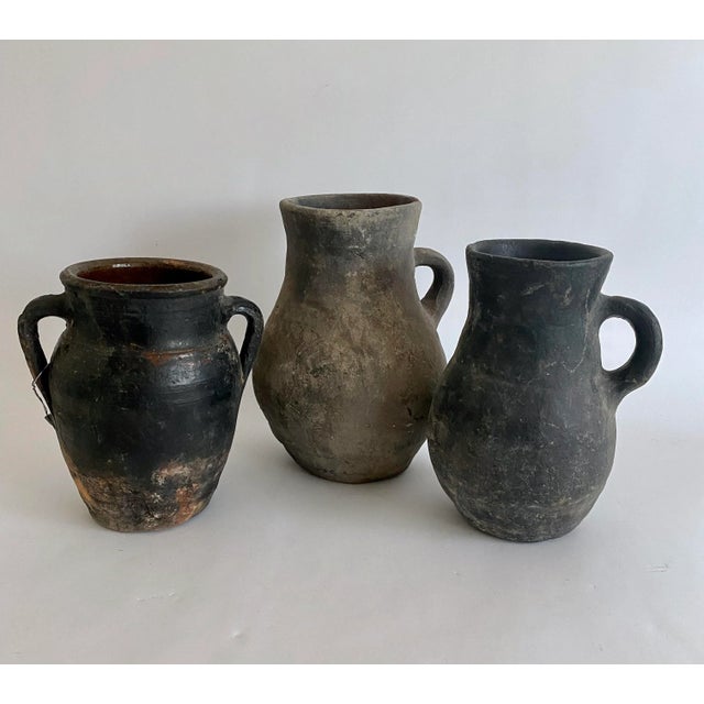 Rustic antique hand-thrown Turkish stoneware pitcher with great age and patina. Not suitable for use for consumption as...
