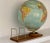 Mid-century modern Repogle 12" diameter, raised relief world globe in the World Nation Series by Meredith Corporation. The...