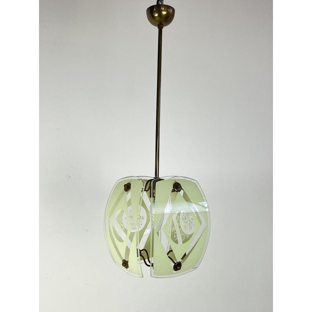 Curved Murano and Brass Murano glass chandelier, 1950s The brass structure are screwed 4 glasses decorated with floral...