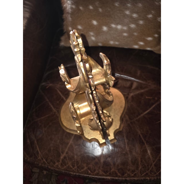 Pretty pair of vintage Italian wall brackets. Each on has a little carved out section in the top shelf surface to hold a...