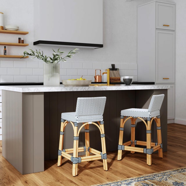 Combining clean lines with tropical materials, this Butler Specialty Company stylish low back counter stool infuses modern...