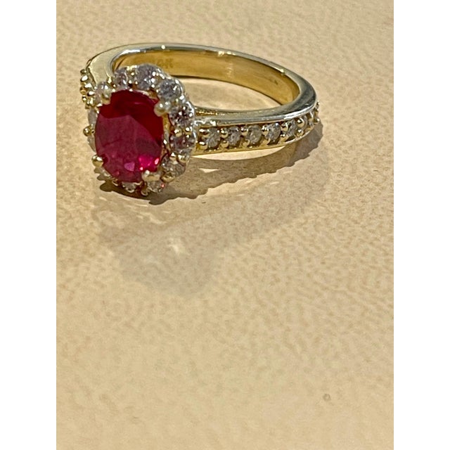6X8 Oval Cut Approximately 1.5 Carat Treated Ruby 14 Karat Yellow Gold Ring Size 6.0 Diamond Brilliant cut approximately...