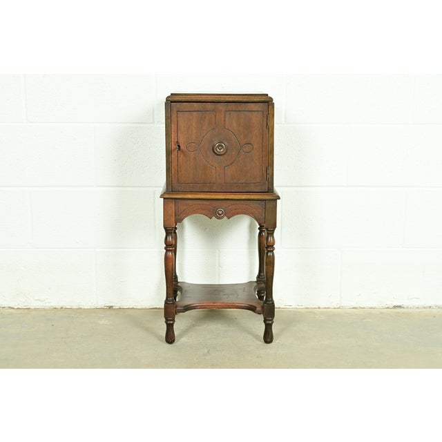 An outstanding English Tudor, William & Mary, or Jacobean style smoker's stand In the manner of Berkey & Gay USA, Circa...