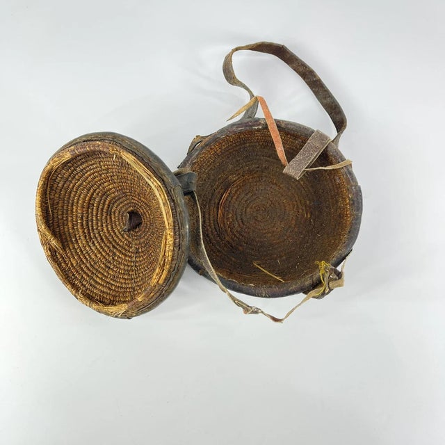 An Ethiopian leather-covered bread basket with a gorgeous patina. Baskets such as this are found among the Oromo and other...