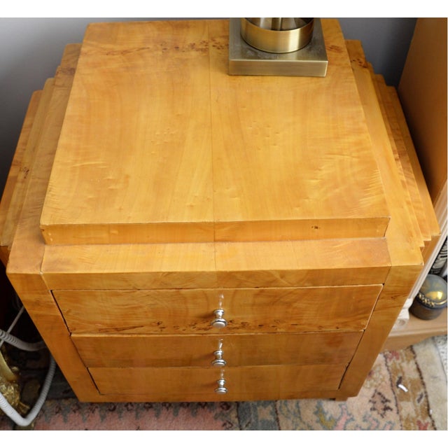 A Mid-Century Art Deco burl wood side table of night stand with three drawers and silver brass pulls. Product Information:...