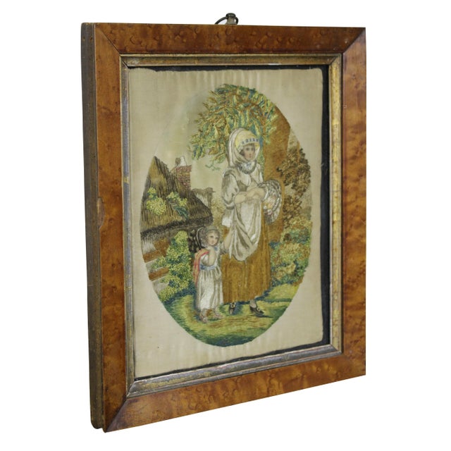 Antique silk embroidered French pastoral scene of a woman and child in front of a cottage. Beautifully framed in a...