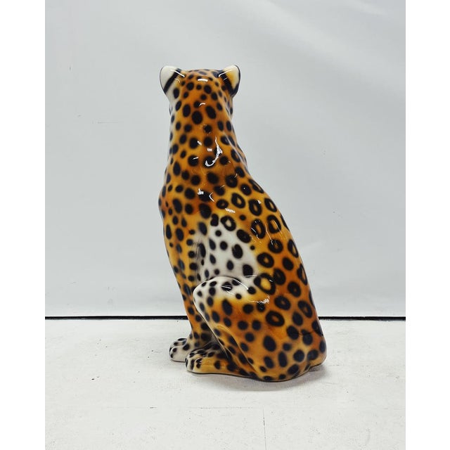 Unique handmade statue of a leopard. This Hollywood Regency statue, crafted from hand-painted ceramic and made in Italy,...