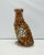 Unique handmade statue of a leopard. This Hollywood Regency statue, crafted from hand-painted ceramic and made in Italy,...