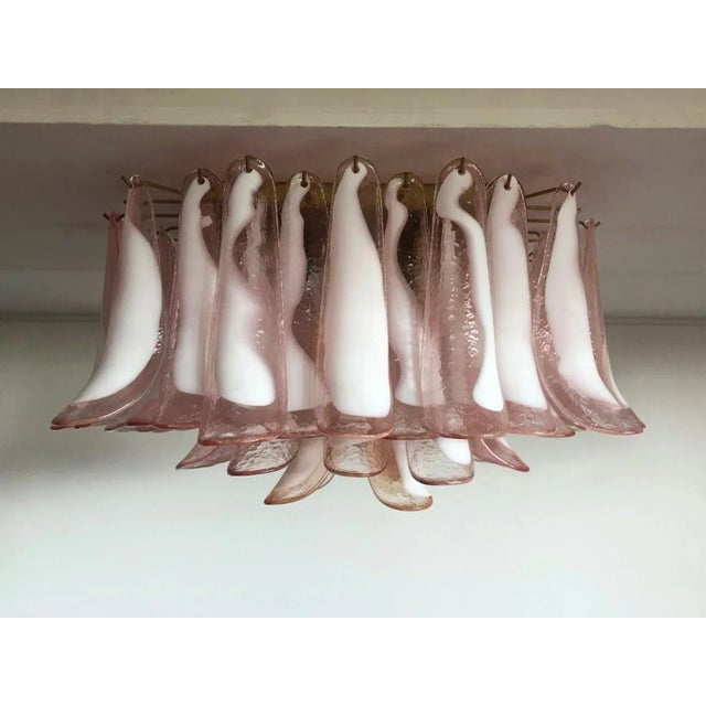 Spectacular ceiling lamp with 64 pink and lattimo Murano glass. Elegant lighting object. Period: late xx century...
