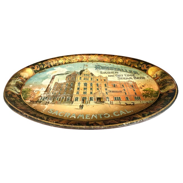 On offer is a highly sought-after pre-Prohibition era lithographed tin serving tray from around 1900, advertising the...