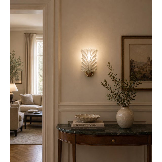 Stunning Murano wall light by artist Ercole Barovier. The wall light consist of a glass leave and a brass structure. It...