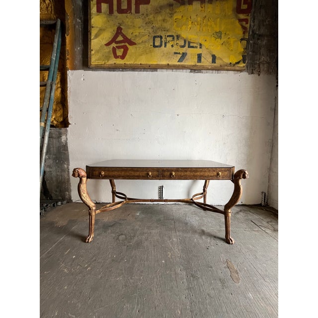 An impressive stylized writing desk by Maitland Smith. Great Egyptian Revival design. Faux Ostrich finish with wonderful...